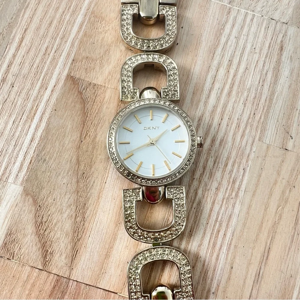 DKNY ladies gold tone crystal studded bracelet watch NEW BATTERY